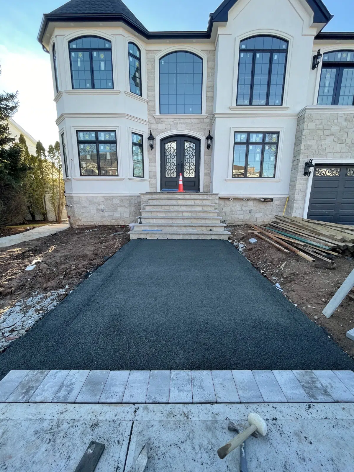 Stone steps and new blacktop walkway at luxury home entrance — APPLE MASONRY INC in Brooklyn